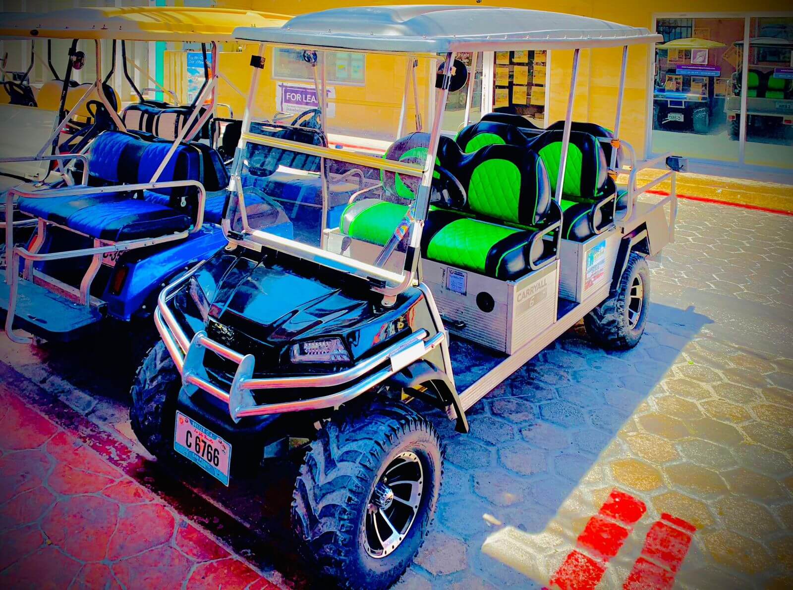 Colorful J&H golf cart fleet in San Pedro, Belize