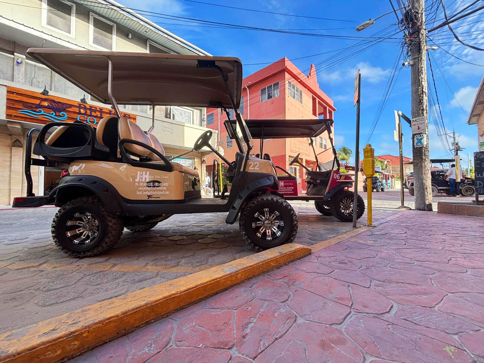 J&H golf cart on a colorful San Pedro street on Ambergris Caye